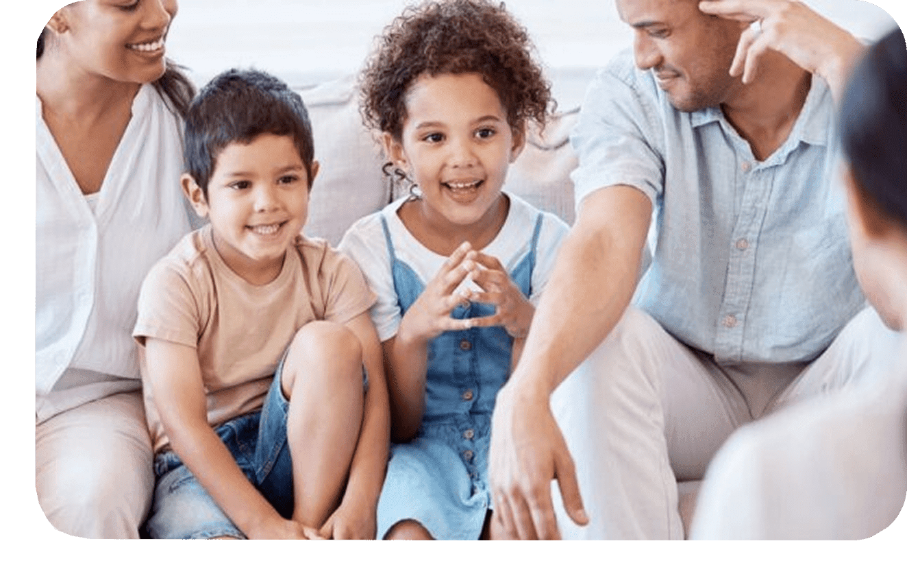 Group-1321316422 A man and two children sitting on the couch